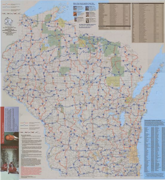 The front of map shows trails throughout the bottom half of Wisconsin and includes text on snowmobile rules and tourism contacts. The reverse shows trails throughout the top half of Wisconsin and lists state and national parks, forests and trails and county/community trails.   