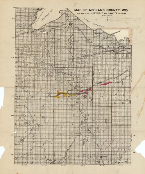 This map shows the locations of school houses, farms, roads, railroads, and Bad River Indian Reservation. Relief is shown by hachures. Yellow and red manuscript annotations show lands conveyed to Penokee Iron Co. and La Pointe Iron Co.