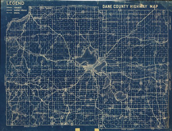This blueprint map shows lakes, roads, railroads, townships and sections. A legend is also included that shows highway surface types.