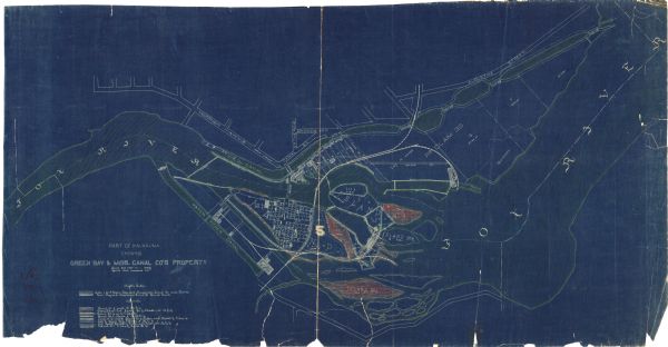This blueprint manuscript map shows land owned by Green Bay & Mississippi Canal Co., Meade, Vilas, Patten, and Hewitt. Streets and the Fox River are labeled. The lower left corner includes a key of markings used on the map of the "North Side". An annotation bleow the title reads: "Copied from assessor's plat."