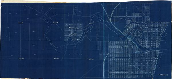 This blueprint map shows lot and block numbers, streets, and right of way for the Two Rivers Branch railroad. The map covers land west to sections 22 and 27 of T19, R23E and east to Lake Michigan in T19, R24E. Lake Michigan and the Manitowoc River are labeled.
