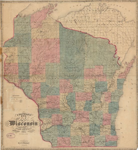 This map shows railroads, counties and towns and includes a township grid. Sections are shown in blue, green, yellow, and pink. Rivers and lakes are labeled including the Mississippi River, Lake Michigan, and Lake Superior. A small portion of Michigan is visible. 

