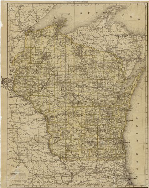 This map shows the cities, counties (outlined in yellow and labeled), rivers, lakes, and the major highways and freeways of Wisconsin and parts of the surrounding states. A small index appears in the lower left corner, showing the scale and the relative city populations.