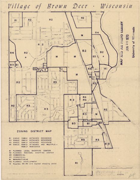 This blue line map shows zoning districts in the Village of Brown Deer. Includes a key in lower left hand corner. Includes street names. The Milwaukee River is seen at the top right corner of the map.
