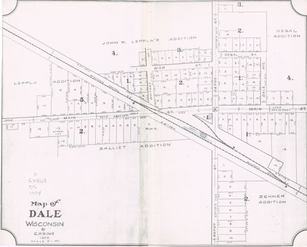 This map shows land parcels, street names, and school locations, and potential land additions to the town. The Wisconsin Central Railroad is labeled.