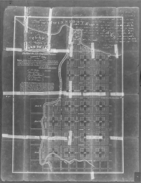 This map shows land parcels, streets, the Fond du Lac River, Lake Winnebaygo (Winnebago), and blocks. Certification is on the left hand corner. The back of the map is inscribed by president and directors of the Fond du Lac Company.