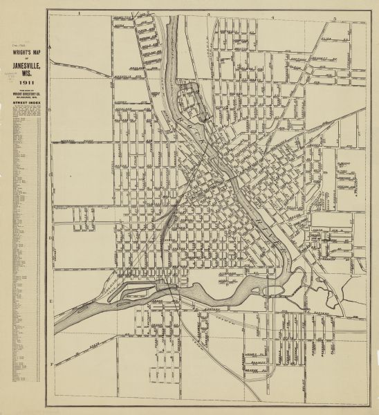 This map shows streets, railroads, the city house numbering system, and the Rock River. The left margin includes a street index.