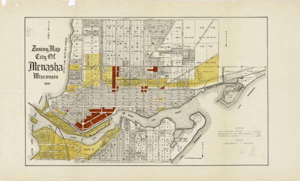This map shows heavy industrial districts (yellow), commercial and light manufacturing districts (red), and residential districts (white) as well as a plat with block and lot numbers, subdivisions, abandoned right of way, marshes, and parks. The Fox River and Lake Winnebago are labeled. 