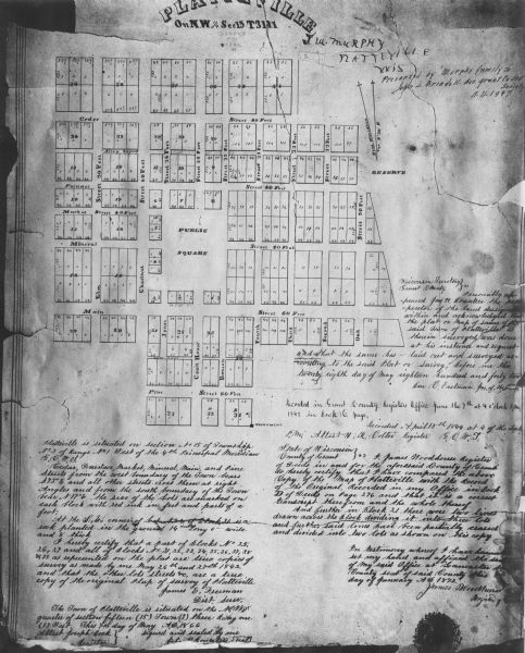 This photocopy of a hand-drawn map shows streets, a public square, lots, and extensive registrations and certifications.
