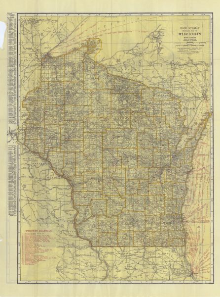 This map shows the entire state as well as portions of Iowa, Illinois, Minnesota, and Michigan. Counties outlined in yellow, cities, rivers, lakes, and railways are labeled. The lower left corner includes a list of Wisconsin Railroads in red. The left margin includes an index of principal cities. Ship routes across Lake Michigan and Lake Superior are also listed in red. The back of the map includes a second map showing auto trails across the state.