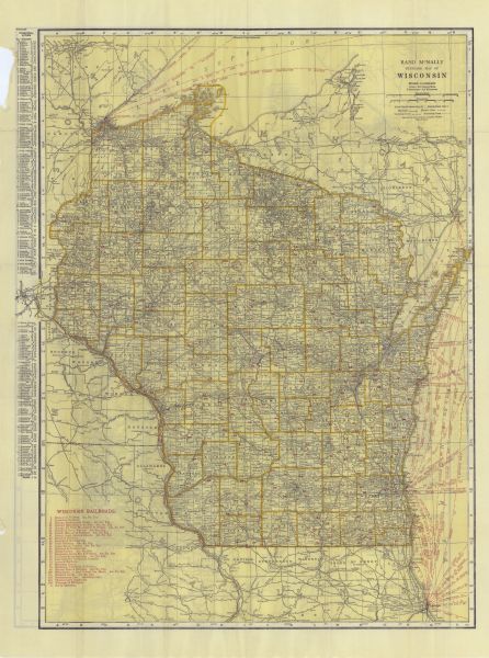 This map shows the entire state as well as portions of Iowa, Illinois, Minnesota, and Michigan. Counties outlined in yellow, cities, rivers, lakes, and railways are labeled. The lower left corner includes a list of Wisconsin Railroads in red. The left margin includes an index of principal cities. Ship routes across Lake Michigan and Lake Superior are also listed in red. The back of the map includes a second map showing auto trails across the state. 