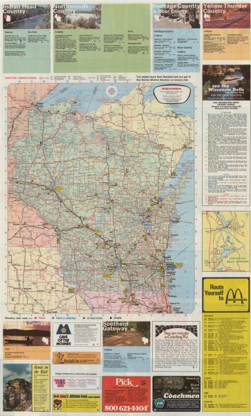 This colored map displays Wisconsin and portions of bordering states, including a detailed map of the Wisconsin Dells area. Surrounding the map are multiple color ads for tourist destinations, including a detailed map and listing of lodgings, attractions, and restaurants in the Dells. Other tourist destinations are designated by region, for example, "Indian Head Country," "Heritage Country and Door County," " Northwoods Country," and "Yellow Thunder Country." A multi-statewide list of McDonald's restaurants is provided. On the back of the map are detailed maps of Duluth-Superior, Green Bay, Kenosha, Madison, Milwaukee, Eau Claire, and Racine. At the top right is a map key indicating road classifications and symbols for other map features. Below this is a "Cities and Towns Index," with map locations and populations. At bottom left is a mileage chart of distances between key cities. There are numerous commercial ads geared to the tourist, with emphasis on Standard Oil products and services.