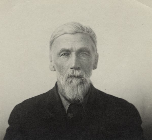Quarter-length portrait of unidentified man with a beard and moustache. He is wearing a jacket, shirt and tie.