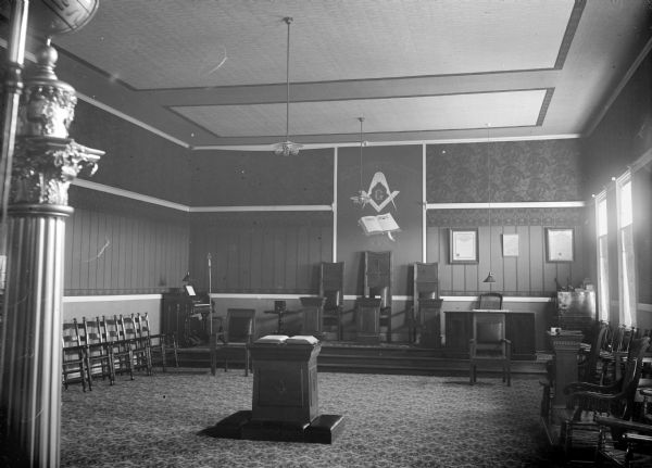 Interior of a Masonic Lodge, Black River Falls, No. 74, A.R.&M., decorated by C.W. Reiels. The lodge occupied the third floor of the center Main Street block that also housed Parter's Drugstore, Jones & Marsh, and the First National Bank.