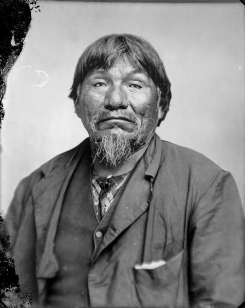 Studio portrait of a Native American man posed sitting, probably Black Hawk, who was the joint chief of the Winnebago with Winneshiek. 