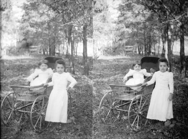 Glass negative with two images. Left, a girl posed standing by a baby carriage with a baby girl, slightly out of focus. Right, same components as the left image.
