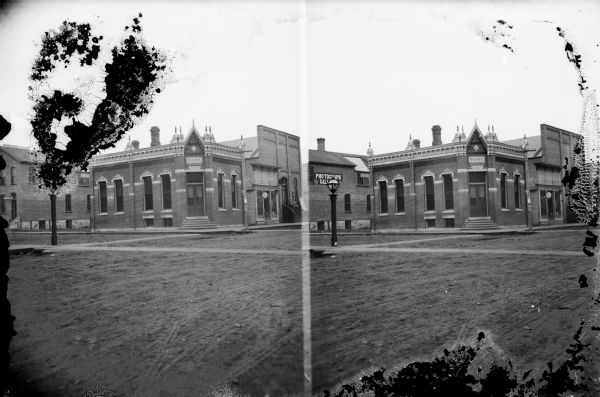 Stereograph of the Jackson County Bank at the southwest corner of Main Street and First Street in Black River Falls.