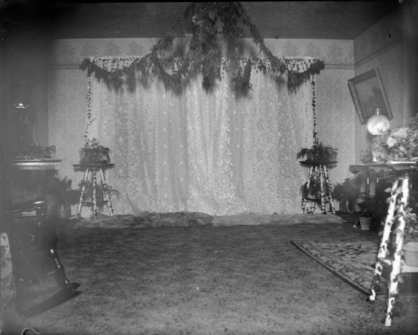 Interior portrait of a decorated room, probably for a wedding.