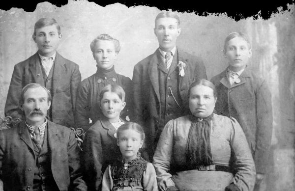Studio group portrait of the Charlie Lubow, Sr., family. Identified from left to right. Standing, back row: Albert Lubow, Charlie Lubow, Jr., and Henry Lubow. Sitting and standing, front row: Charlie Lubow, Sr., Johnny Lubow, Annie Lubow (later Gaede), and Mrs. Charlie Lubow, Sr.