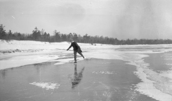 A man skates near the shore of Europe Bay.