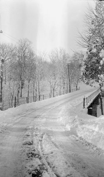 Snow-covered road and bridge near the photographer's home.