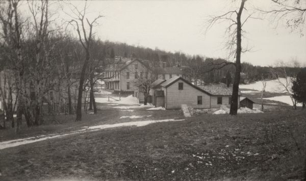 Workers' houses stand in front of the Fayette Tourists Lodge. After the Jackson Iron Company left in 1891, Fayette became a tourist destination and is now a State Park.