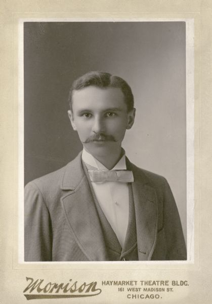 Quarter-length portrait of the photographer Ferdinand Hotz (March 14, 1868 - December 28, 1946) as a young man. He wears a fine suit and a single pearl stud.
