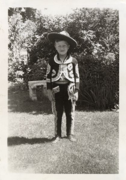Robert E. Faber (b. 1933) posing in his backyard wearing a Mexican cowboy costume purchased by his parents Michael and Margaret (Diebold) Faber when they vacationed in Mexico City, Mexico during January 1938.

Robert's home was located in the 2500 block of Van Hise Avenue, Madison, Wisconsin.

