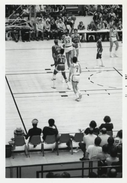 The Milwaukee Bucks star, Kareem Abdul-Jabbar, shoots a skyhook (his signature shot) on the court at the Dane County Coliseum. The Milwaukee Bucks were playing the Houston Rockets.