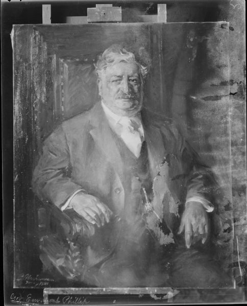 Photograph of a painted portrait of Governor Emanual Lorenz Philipp, the 23rd Governor of Wisconsin. He was a conservative Republican, born in Honey Creek in Sauk County. He served from 1915 until 1921.