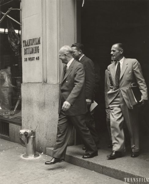 Rosser Reeves and Dwight D. Eisenhower leaving the Transfilm Building after filming fifty political spots in one day. (Rosser Reeves wearing glasses.) Eisenhower was not happy making television commercials, he was heard to say "To think that an old soldier should come to this."
