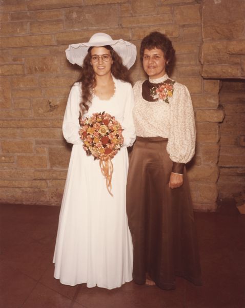 Full-length portrait of a bride and her mother before the ceremony at the First Unitarian Society Meeting House.
