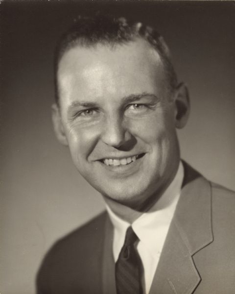 Quarter-length portrait of Philip G. Kuehn. He was the Wisconsin Republican State Chairman from 1955 to 1958. In his first bid for governor, in 1960, he nearly upset the incumbent, Gaylord Nelson, losing by 50,000 votes out of 1.7 million. In 1962 he lost by 12,000 votes out of 1.2 million, to John W. Reynolds. Although Mr. Kuehn was a conservative, he pressed for a state sales tax. His second defeat was attributed to that issue.