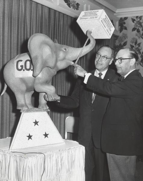 Ralph H. Bonnell, delegate from the Republican Party of Massachusetts, admires the GOP mascot, an elephant, with another unidentified man at the Republican National Convention.