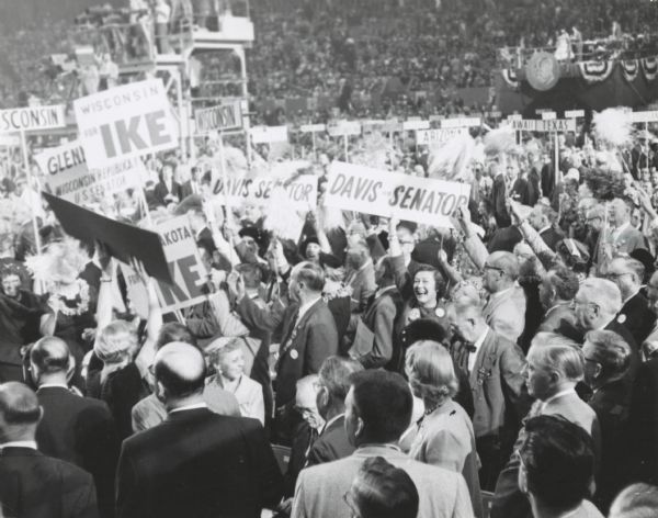 The Wisconsin delegation at the Republican National Convention. It was held in the "Cow Palace" in San Francisco. President Eisenhower was re-nominated for a second term. Some of the signs read, "Wisconsin For Ike," "Davis for Senator" and "Glenn Davis for Wisconsin Republican U.S. Senator."