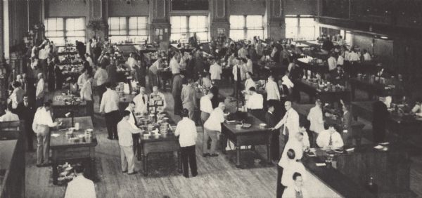 Buyers examine samples of grain for sale at the cash trading tables of the Minneapolis Grain Exchange.