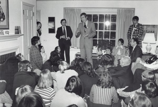 Congressman Morris Udall speaking to a Wisconsin audience during his campaign for the presidency. Udall finished a close second to Jimmy Carter in the Wisconsin primary. Congressman David R. Obey, who was a Udall supporter, is standing to Udall's right.