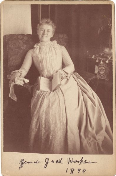 Cabinet card of an informal full-length portrait. (Mrs. Ben) Jessie Jack Hooper relaxes in a chair. The portrait may have been taken at the Sawyer House in Oshkosh. She was a suffrage speaker, Democratic Party leader, and worker for permanent peace.

Mrs. Hooper is wearing an avante-garde or artistic dress, a garment that came out of the 1880s dress reform movement.