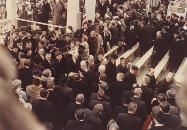 Elevated view of special guests leaving the platform after the inauguration of Richard Nixon. In the center can be seen Wisconsin Congressman Melvin Laird, who was Nixon's secretary of defense, and next to him Attorney General John Mitchell.