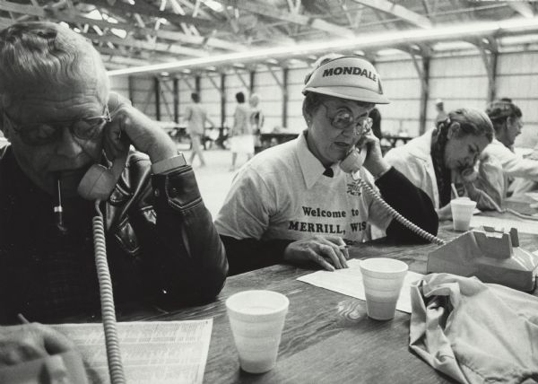 Loyal Democrats sit at a table while calling to remind local residents of the upcoming Merrill rally, at which both Walter Mondale and Geraldine Ferraro appeared.
