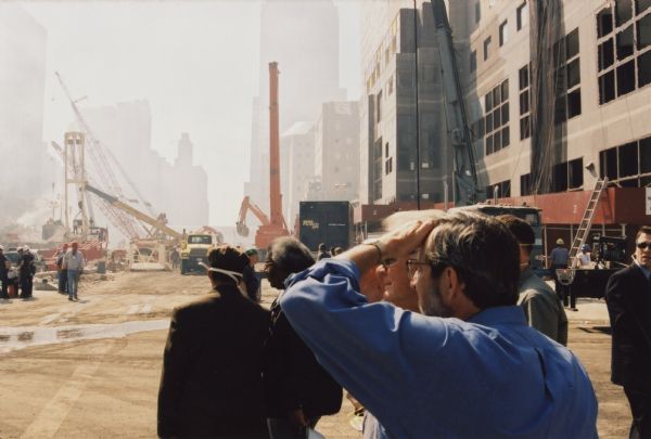 Wisconsin Congressman David R. Obey at the 9/11 Ground Zero site viewing the damage to the World Trade Center. Behind Obey is the World Financial Center complex which also suffered major damage from the collapse of the twin towers.