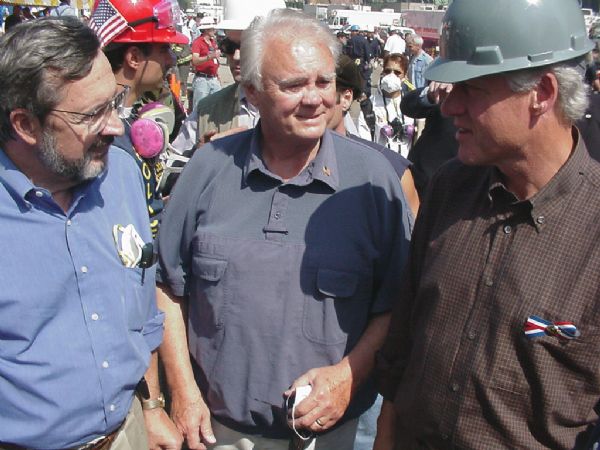 Former President Bill Clinton, in the hard hat on the right, with Wisconsin Congressman David Obey (left) and Florida Congressman Bill Young, the Republican and Democratic leaders of the House Appropriations Committee. Obey and Young were present at Ground Zero only a few days after the 9/11 attack in order to make a first-hand assessment of the emergency federal funding needed for the clean-up.