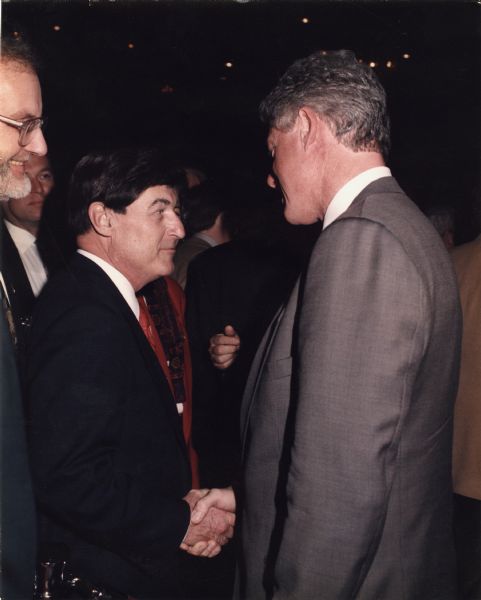 State Senator Michael Ellis shakes hands with President Bill Clinton.
