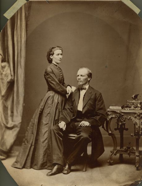 Henry C. Koch and his wife, Johanna Knab Koch, pose for a formal studio portrait. Henry C. Koch was a German born architect that designed many Wisconsin schools, court houses and other public buildings. In 1862, at the age of 20, he enlisted in the 24th Wisconsin Infantry. By the next year his knack for drawing maps had been discovered and he became one of General Philip Sheridan's topographical engineers.
