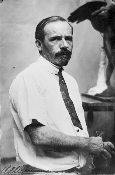 Portrait of sculptor Adolph Weinman. He sculpted the South Pediment at the Wisconsin State Capitol, and the seated figure of Abraham Lincoln that sits in front of Bascom Hall at the University of Wisconsin.