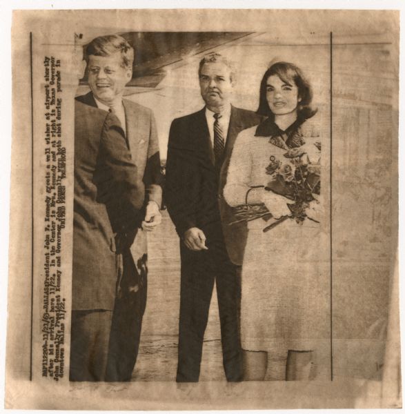 Original UPI Wirephoto transmission. Caption reads: "President John F. Kennedy greets a well wisher at airport shortly after his arrival here 11/22. In the Center is Mrs. Kennedy and at right is Texas Governor John Connally, President Kenney [sic] and Governor John Connally were both shot during parade in downtown Dallas 11/22."