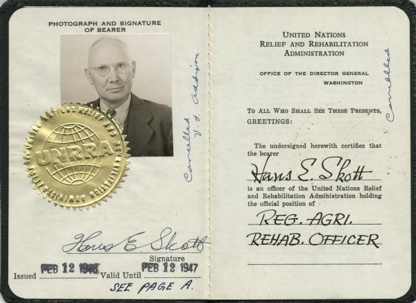 Identification papers of Hans E. Skott, an officer with the United Nations Relief and Rehabilitation Administration. His title was "Registered Agricultural Rehabilitation Officer." The ID was issued FEB 12 1946 and was valid until FEB 12 1947. His photograph is on the left side with the gold seal of the UNRRA partially covering the lower left corner.