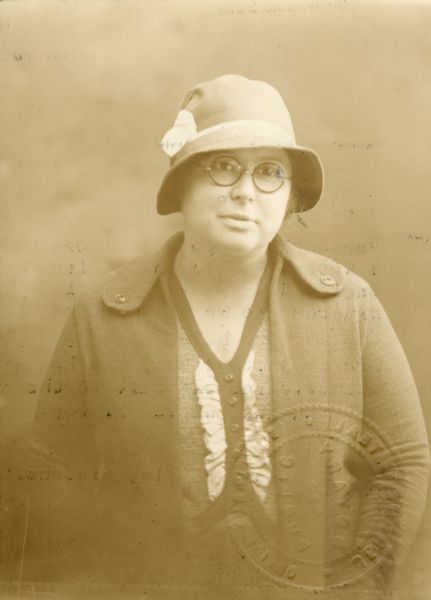 Waist-up portrait of Dr. Kate Newcomb. This photograph was submitted with her application to the Wisconsin Medical Examining Board when she applied for her physicians license in Wisconsin.