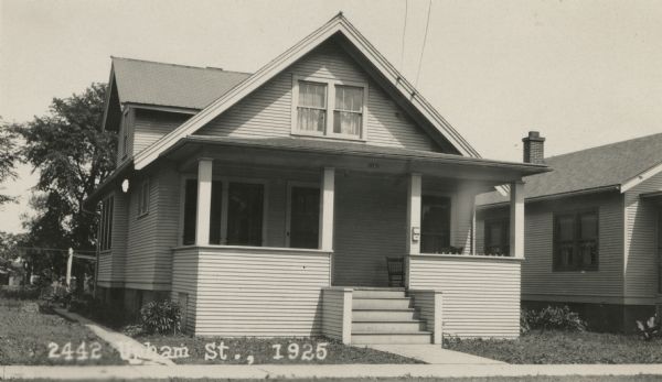 Photographic postcard view from street of the house at 2442 Upham Street. Built by Willard Droster. Caption reads: "2442 Upham St., 1925."