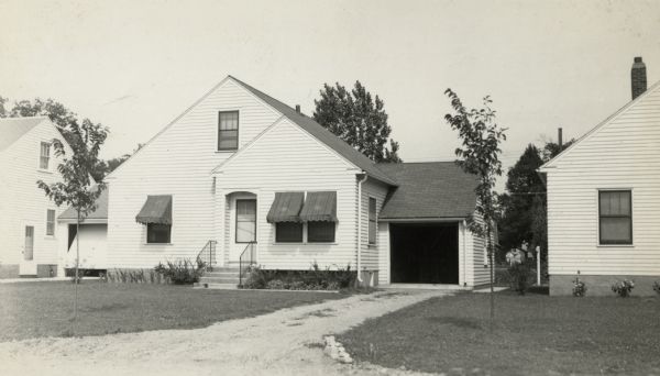 Exterior view of the house at 1513 Hooker Avenue. The home was built by Willard Droster.